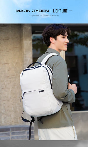 White compact laptop backpack with black trim, top handle, and padded back straps
