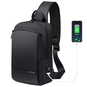 Black waterproof compact crossbody bag with top handle and adjustable shoulder strap.