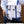Blue and white backpack-style messenger bag with front zip pocket and adjustable shoulder straps