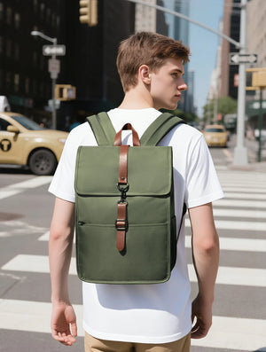 Green waterproof commuter backpack with front flap, buckled strap and top carry handle
