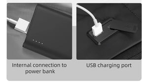 Black backpack showing internal power-bank connection and USB charging port