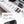 Black expandable waterproof backpack open on desk with organized compartments and gear