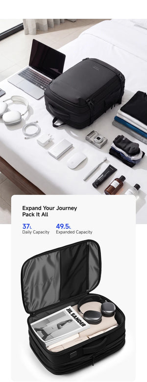 Black expandable waterproof backpack open on desk with organized compartments and gear