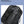 Black waterproof travel backpack with fabric surface showing raindrop protection