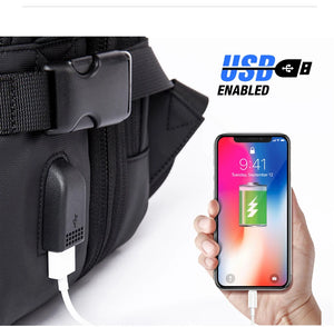 Black backpack with USB charging port detail next to a phone cable connection