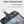 Gray waterproof toiletries bag interior with clear pocket, elastic holder, and zipper