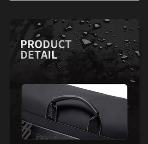 Black bag close-up of padded top handle and textured waterproof flap panel
