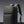Dark gray water-resistant travel backpack with padded top and side straps