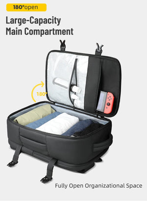 Black backpack fully opened to reveal organizer space and large main compartment.