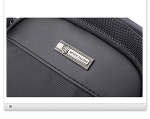 Grey compact waterproof messenger bag with stitched edge and ARCTIC HUNTER logo patch