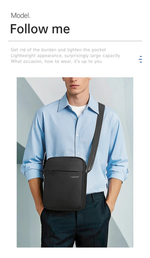Black compact waterproof crossbody bag with adjustable shoulder strap, worn at chest.