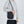 Black compact waterproof messenger bag with wide strap and front zip closure