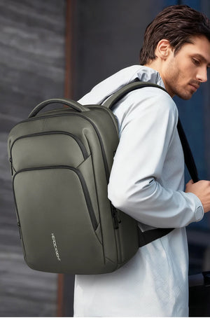 Green backpack worn on the back with padded shoulder straps and front pockets