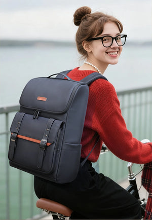 Black commuter backpack with top flap, front organizer pocket, and adjustable straps