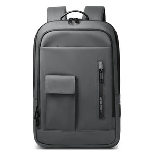 Lightweight waterproof compact backpack in grey with front zip pocket and top carry handle loop.