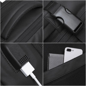 Black backpack fabric close-up with textured panels, stitching, and reinforced seams