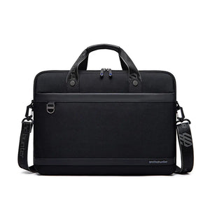 Black waterproof laptop bag with top handle, dual front zip pockets, and shoulder strap