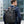 Black roll-top waterproof backpack worn for work, ride, travel, or outdoor use.
