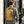 Yellow and black compact waterproof backpack worn on back with padded shoulder straps