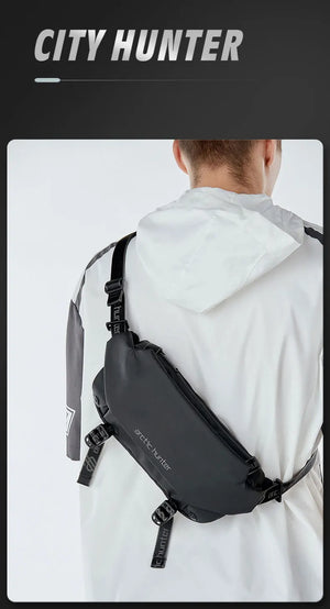 Black waterproof crossbody sling worn on shoulder with adjustable strap