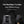 Black travel backpack with telescoping handle, sunglasses hook, and back zipper pocket