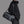 Waterproof duffel bag in black with long strap, zip front panel, and side pockets