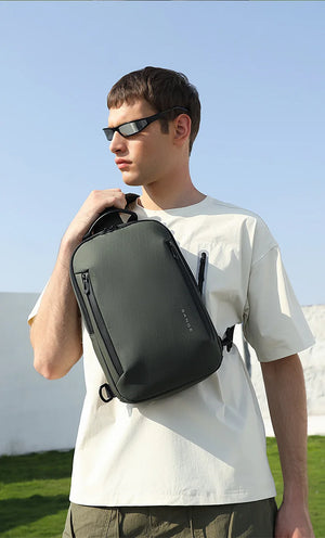 Lightweight waterproof crossbody bag, olive green, side view with zip pocket and strap