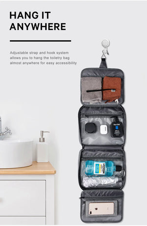 Hanging gray waterproof toiletries bag with open compartments and zippered pockets