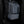 Gray waterproof travel backpack worn by person, front zip and side pocket details