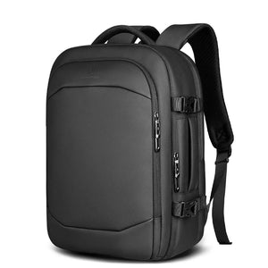 Black waterproof travel backpack with front pocket and padded shoulder straps
