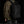 Black waterproof travel backpack worn on back with front zipper panel