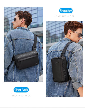 Black crossbody bag worn over denim jacket, front-facing and slanted strap