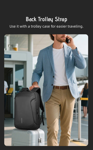 Black travel backpack with back trolley strap for attaching to a rolling suitcase