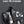 Black backpack opened to show interior compartments with bundled contents and organizers
