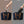 Two tech storage bag cases in a tote, shown before and after organizing
