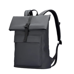 Grey expandable roll-top waterproof travel backpack with front strap and padded back