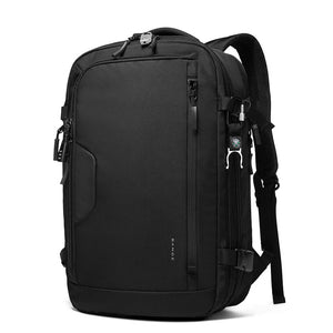 Black expandable travel backpack front view with layered pockets and shoulder strap