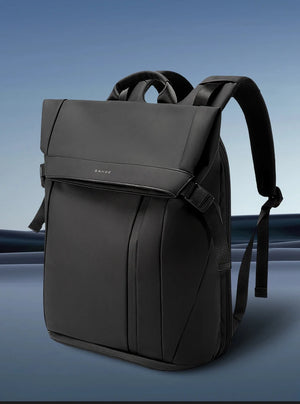 Black backpack with top handle and curved shoulder straps, shown angled on display.