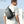 Minimalist sling bag in dark gray worn across chest with adjustable shoulder strap.