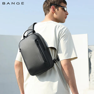 Minimalist sling bag in dark gray worn across chest with adjustable shoulder strap.