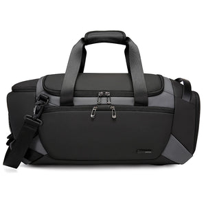 Black duffle and sports bag with top handle, shoulder strap, and front zip pocket