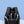 Black backpack with breathable mesh-style back panels and reinforced shoulder straps.