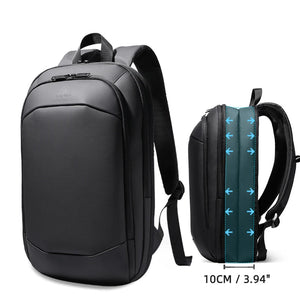 Dark gray and black expandable waterproof travel backpack with padded back and top handle