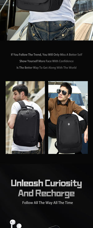 Black waterproof travel backpack worn on back with wide straps and front pocket