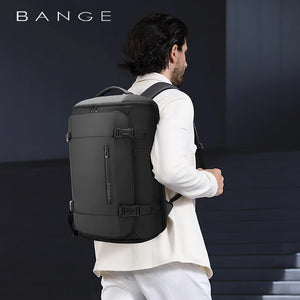 Waterproof business travel backpack worn on back with padded straps and top carry handle
