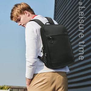 TIGERNU B9013 backpack being worn on back, black with two shoulder straps