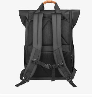 Black roll-top travel backpack back view with padded shoulder straps and ventilated panel