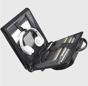 Open laptop backpack interior with laptop sleeve and accessories