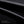 Black textured fabric panel for waterproof crossbody bag
