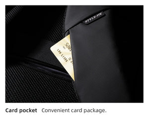 Textured dark backpack pocket with card slot, interior zipper opening